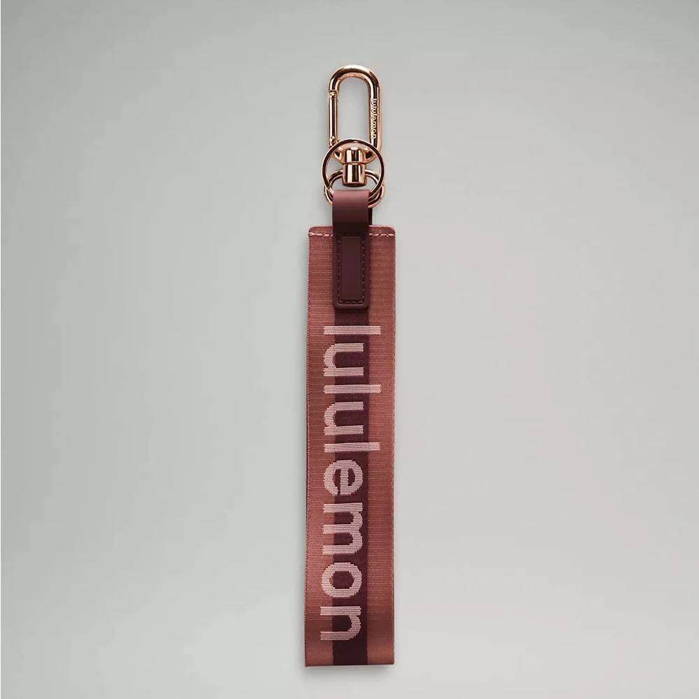 Lululemon Never Lost Keychain Wordmark- Garnet/Spiced Chai/Rose Gold